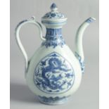 A CHINESE MING STYLE BLUE AND WHITE PORCELAIN LIDDED EWER, decorated with dragons, 27cm high.