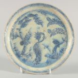 A 15TH CENTURY PERSIAN TIMURID GLAZED POTTERY DISH, with traces of lustre, 22cm diameter.