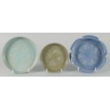 A COLLECTION OF CHINESE GLAZED POTTERY DISHES, comprising two celadon circular dishes and one blue
