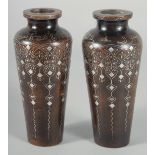 A FINE PAIR OF OTTOMAN TURKISH SILVER INLAID WOODEN VASES, signed, 16.5cm high.