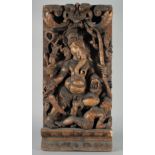 A LARGE INDIAN CARVED WOOD PANEL OF GANESH, 76.5cm x 37cm.