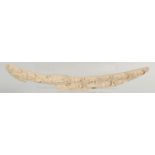 AN EXCEPTIONAL NORTH AMERICAN NATIVE INDIAN CARVED MARINE IVORY / WALRUS TUSK, finely carved with