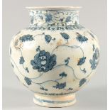 A FINE 16TH/17TH CENTURY IZNIK STYLE PERSIAN SAFAVID GLAZED POTTERY VASE, painted with flower