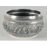 A FINE 19TH CENTURY BURMESE SILVER BOWL, relief-decorated with scenes of multiple figures,