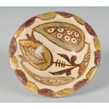 A SMALL ABBASID GLAZED POTTERY BOWL, the interior painted with foliate motif, 11cm diameter.