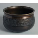 A CHINESE BRONZE BOWL with a band of archaic-style decoration, the base with character mark, 15cm