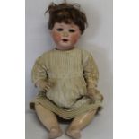 Large bisque socket head doll marked Jutta 1914 with bent limb composition body, jointed wrists,