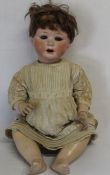 Large bisque socket head doll marked Jutta 1914 with bent limb composition body, jointed wrists,