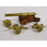 Selection of brass cannons and a brass dice