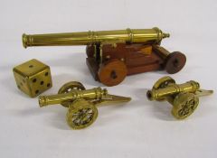 Selection of brass cannons and a brass dice