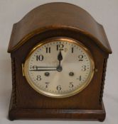 Early 20th century 8 day oak case mantel clock with barley twist corners & a domed top
