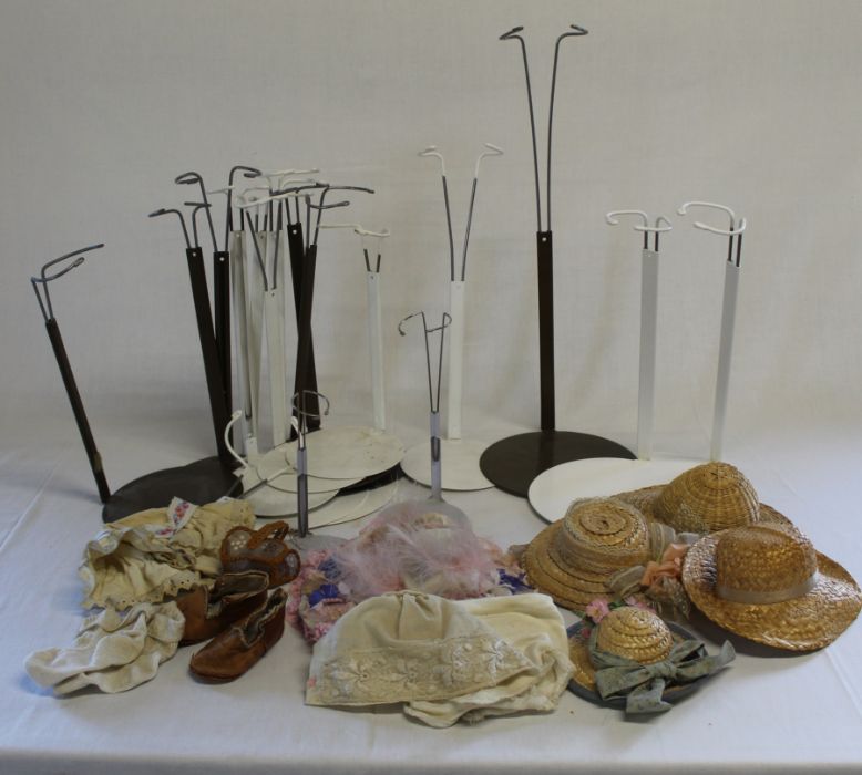 Quantity of doll stands, bonnets, straw hats etc.
