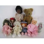 Collection of vintage dolls and a teddy bear