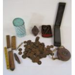 Collection of old pennies and small tools