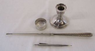 Silver pencil London 1965, napkin ring Sheffield 1898 weight 0.63 ozt, candlestick Birmingham 1979 H