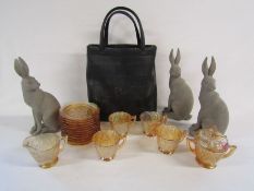 Collection of orange gypsy glass, 3 hare ornaments and a vintage bag