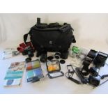 Canon T70 Camera with Sunpak Thyristor auto zoom 3600,  Canon and Teleplus lens, filter kit and