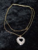 9ct gold chain with white gold & diamond chip heart shape pendant. 3.5g