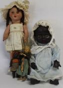 Black plastic doll marked "OK Kader" with sleeping eyes, composition doll with sleeping eyes, open