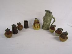Collection of pewter lidded jugs and stoneware bottles, 19th c stoneware toby jug modelled as a