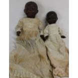 Black bisque socket head doll marked with an impressed triangle Germany 4 1/2 with fixed eyes and