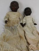 Black bisque socket head doll marked with an impressed triangle Germany 4 1/2 with fixed eyes and