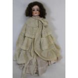 Bisque shoulder head doll with marks for Cuno & Otto Dressel Germany, fixed eyes, open mouth and