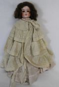 Bisque shoulder head doll with marks for Cuno & Otto Dressel Germany, fixed eyes, open mouth and