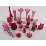 Large collection of cranberry and red coloured glass