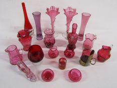 Large collection of cranberry and red coloured glass