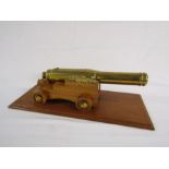Large heavy brass cannon with wooden plinth approx. 43cm (cannon only)