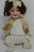 Otto Reinecke bisque socket head doll marked "RM 924 Germany" on bent limb composition body with