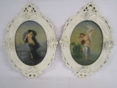 Pair of oval frames with cupid moulding depicting semi nude females, signed R.Wilson approx. 22.