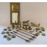 Selection of brass items including toasting forks, horse brasses, mirror etc