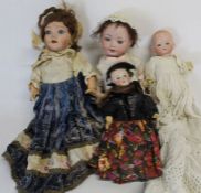 Small bisque head doll marked "UNIS France" on composition straight limb body with fixed eyes,