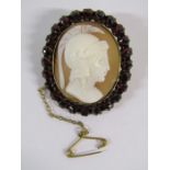 Roman Centurion cameo brooch in yellow metal mount with garnet surround, some damage to bottom of