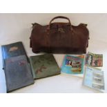 Leather holdall, empty vintage postcard albums and postcard reference books