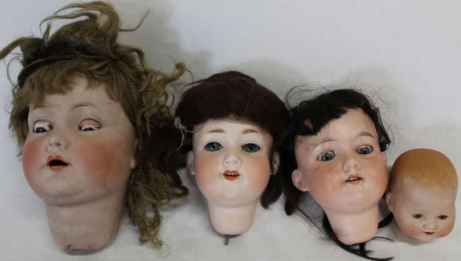 4 bisque socket dolls heads:- K R Simon & Halbig 117 Germany 80 with sleeping eyes & open mouth,