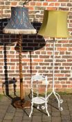 Wrought iron standard lamp, wooden standard lamp & a cast iron stand