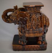 Large brown ceramic elephant stand. Ht 58cm