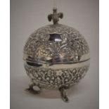 Spherical Anglo Indian white metal pot with repousse decoration & bird finial Ht 12cm