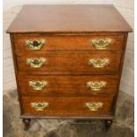 Small mahogany chest of drawers on castors with brass swan neck handles