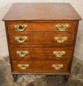 Small mahogany chest of drawers on castors with brass swan neck handles