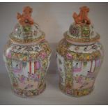 Pair of modern Chinese lidded vases with foo dog finials. Ht 50cm