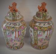 Pair of modern Chinese lidded vases with foo dog finials. Ht 50cm