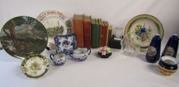 Collection of items to include nursing books, Mats Jonasson glass block with otter, Magna Carta
