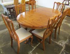 Twin pedestal extending pine dining table and 6 elm dining chairs