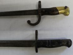 2 bayonets, one marked US Remington 1917 and one with serial number to guard