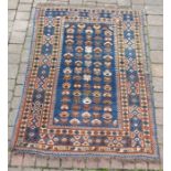 Persian carpet blue ground with red and cream design approx. 163cm x 116cm