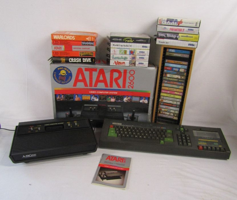 Atari 2600 (missing controllers) with games and Amstrad console also include some Sega Mega Drive